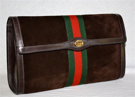 gucci clutch price|gucci vintage suede clutch.